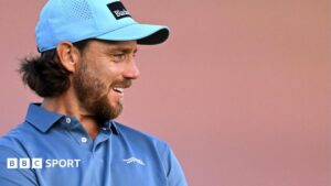 Herbert leads The Open after historic round and DeChambeau rules drama